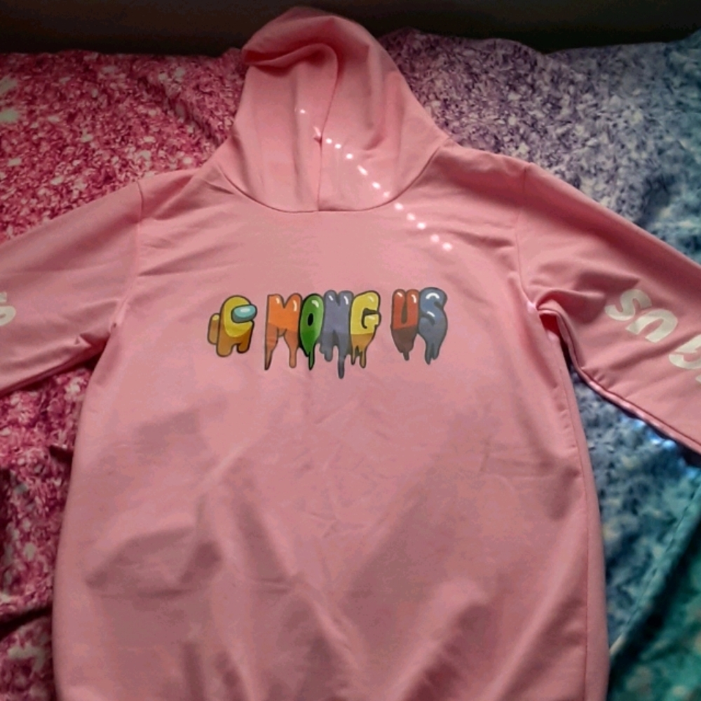 Matching girls among us sweat shirt and sweats.